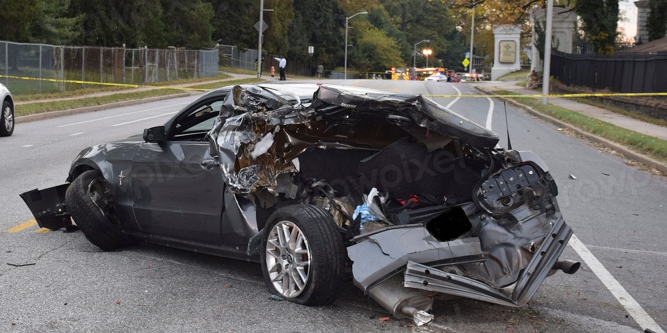 A car badly damaged in a collision at the roadside