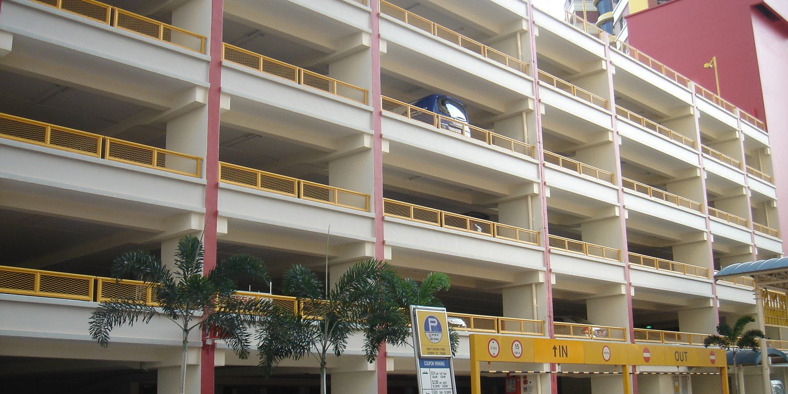 A multi storey car park with rows of parked cars