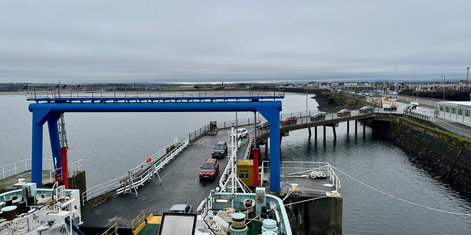 A ferry port with vessels at the quayside