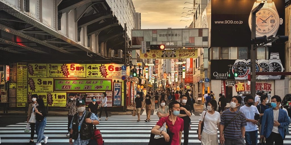 People crossing a busy street in Tokyo