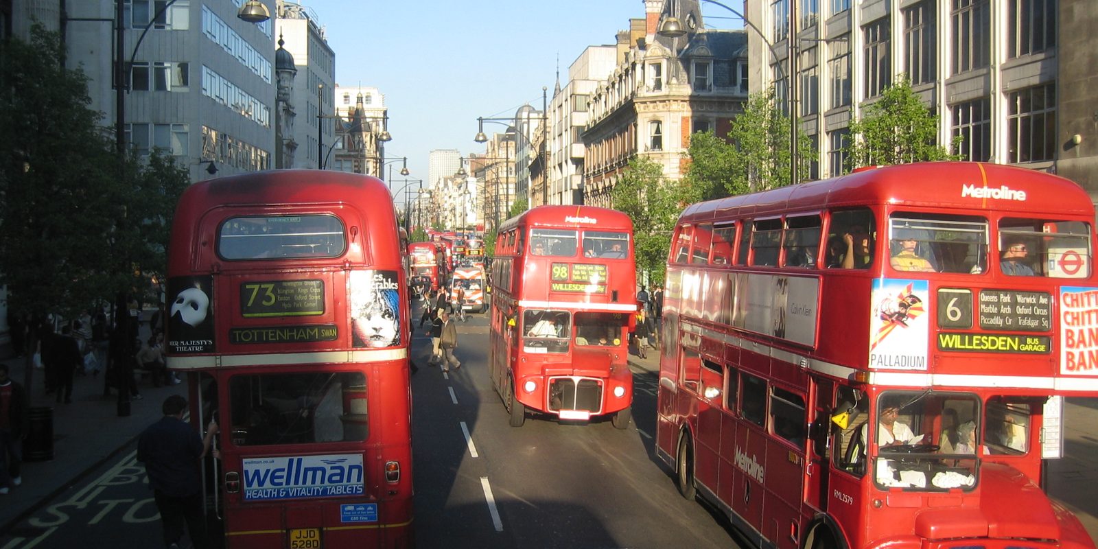 London buses in traffic on a city street