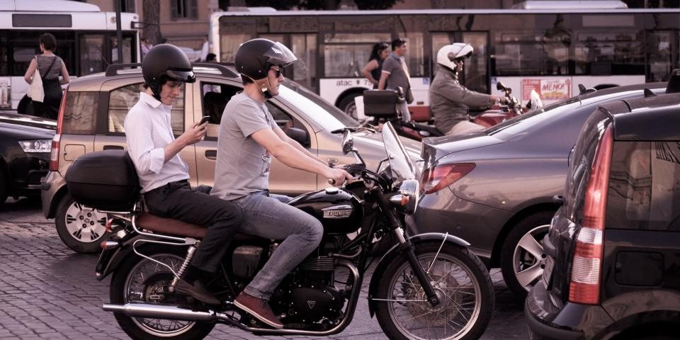 Motorcyclists riding in city traffic