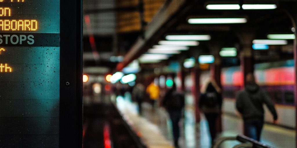 A busy transit station concourse