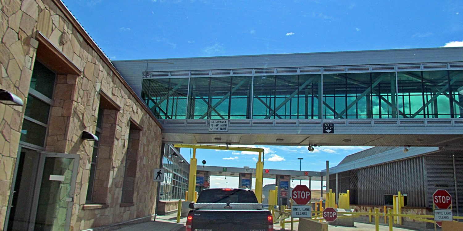 Vehicles queuing at a border and toll plaza