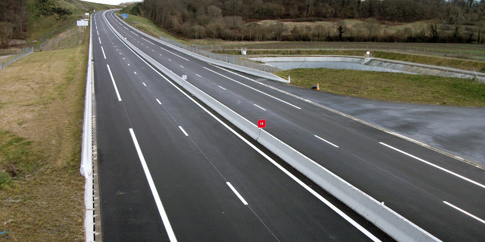 An empty dual carriageway stretching ahead